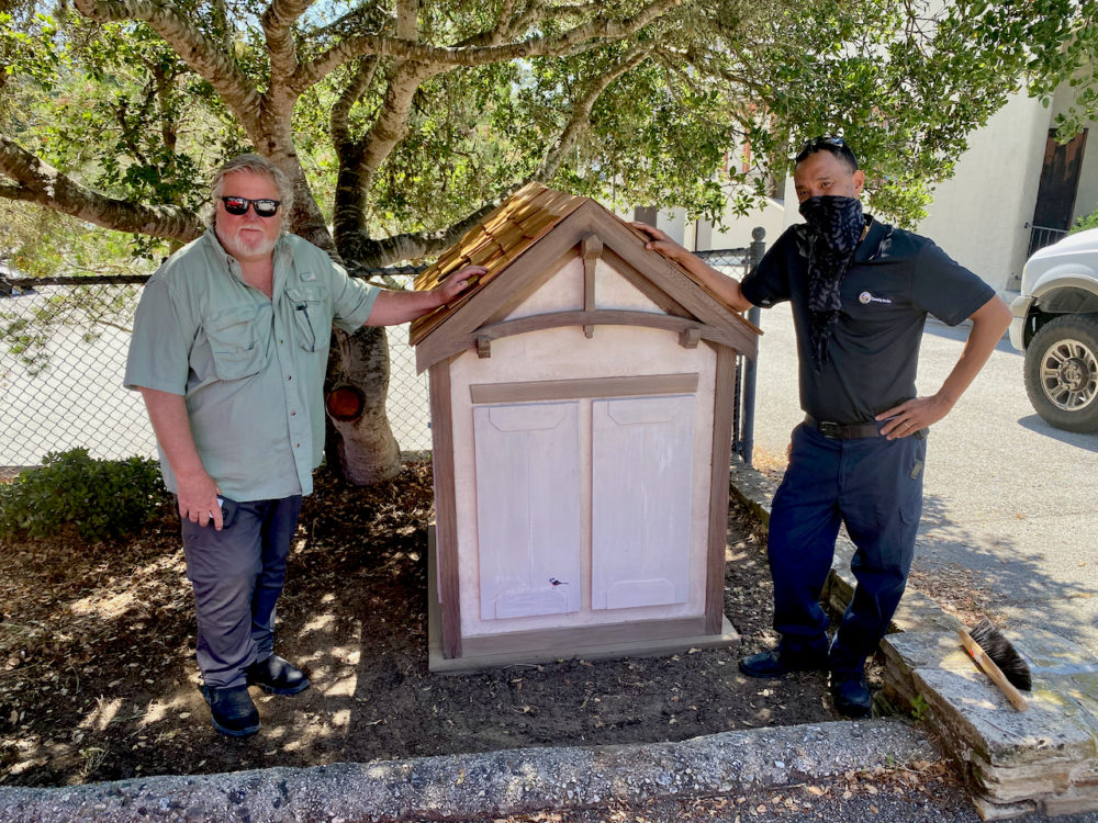 Scott and Cleve install the house